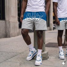 Load image into Gallery viewer, GEEKS Windbreaker Shorts to match Retro Jordan 4 Military Blue sneakers
