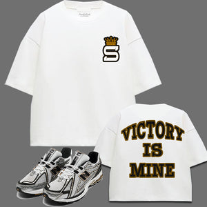 Victory Is Mine Oversized White T-Shirt to match New Balance 1906R White Gold sneakers